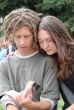 Young stydents reading in street
