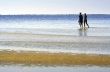 The people go for a walk on the sea