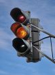 urban stoplight with yellow light
