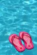 Sandals by a swimming pool