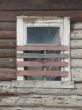 Alone window of aged ruined urban building