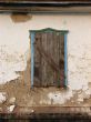 Alone window of aged ruined urban building