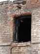 Alone window of aged ruined urban building