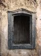 Alone window of aged ruined urban building