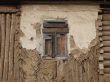 Alone window of aged ruined urban building