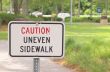 Caution Uneven Sidewalk