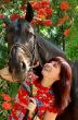 Brunette female model with horse