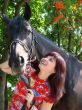 Brunette female model with horse
