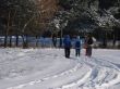 Group walking by winter snowy road