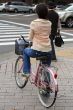 Japanese woman riding bicycle