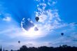 three ballon on cloudy sky