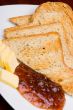 Bread, marmalade and butter, vertical.