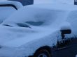 Snowed cars after night snowfall