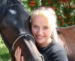 Blond Female Model with Dark Horse