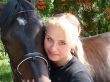 Blond Female Model with Dark Horse