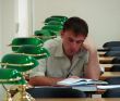 Student reading book in public library