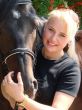 Blond Female Model with Dark Horse