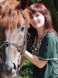 Brunette female model with black horse