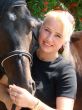 Blond Female Model with Dark Horse