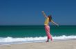 Beautiful woman making poses in the beach
