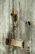 Old barn door with rusty latch