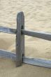 Old wooden fence on a beach