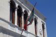 Furled flag on a building in Venice