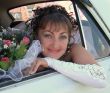 Smiling bride in car window