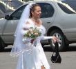 Young bride running on wedding day