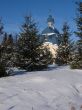 Winter snowy landscape with fur-trees and church