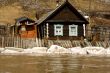 Old house on coast of the spread river
