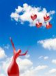 Silhouette of the ballerina with balloons heart