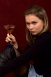 The fine girl with a glass in hands