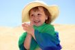 Girl in hat clapping her hands