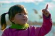 Girl pointing in the sky