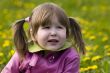Girl with tails in dandelions