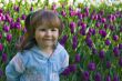 Happy girl in tulips