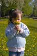 Girl with dandelions bouquet