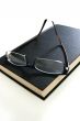 eyeglasses on book