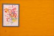 abstract painting and orange wall