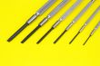 screw drivers on yellow