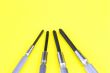 metal screw drivers on yellow