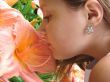 The girl smelling a flower