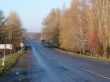 Autumn road with deep blue sky