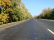 Autumn road with deep blue sky