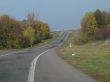 Autumn road with deep blue sky