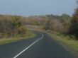 Autumn road with deep blue sky
