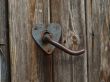 Aged door handle on wooden door
