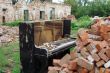 The Old Broken Piano Among Ruins
