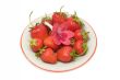 Strawberries on a saucer, isolated on white